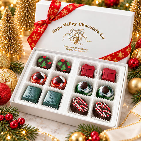 Open 12-piece Napa Valley Chocolate Company Christmas truffle gift box with six decorated chocolate flavors, white candy cups, and festive red ribbon.