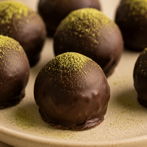 Close-up of Wasabi Chocolate Truffles with hand-dipped texture and wasabi dusting.
